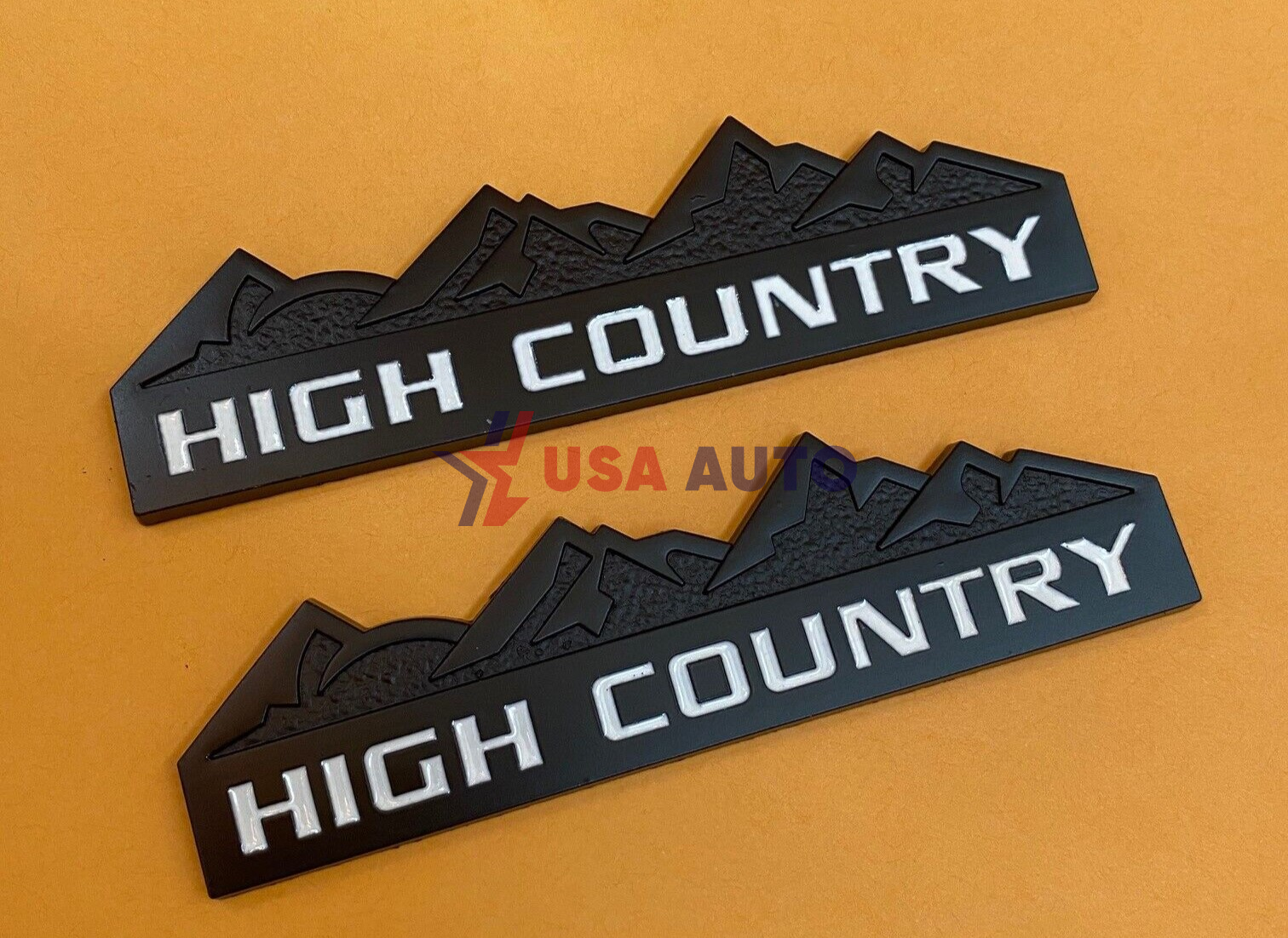 ემბლემა HIGH COUNTRY 125x35mm შავი, თეთრი წარწერით (რკინა)